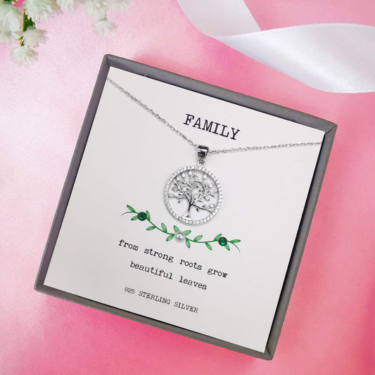 High quality sterling silver tree of life necklace round with cubic zirconia.  comes boxed with hand embellished insert featuring the quote from strong roots grow beautiful leaves".  The perfect family quote gift for mum, sister, aunt grandmother.