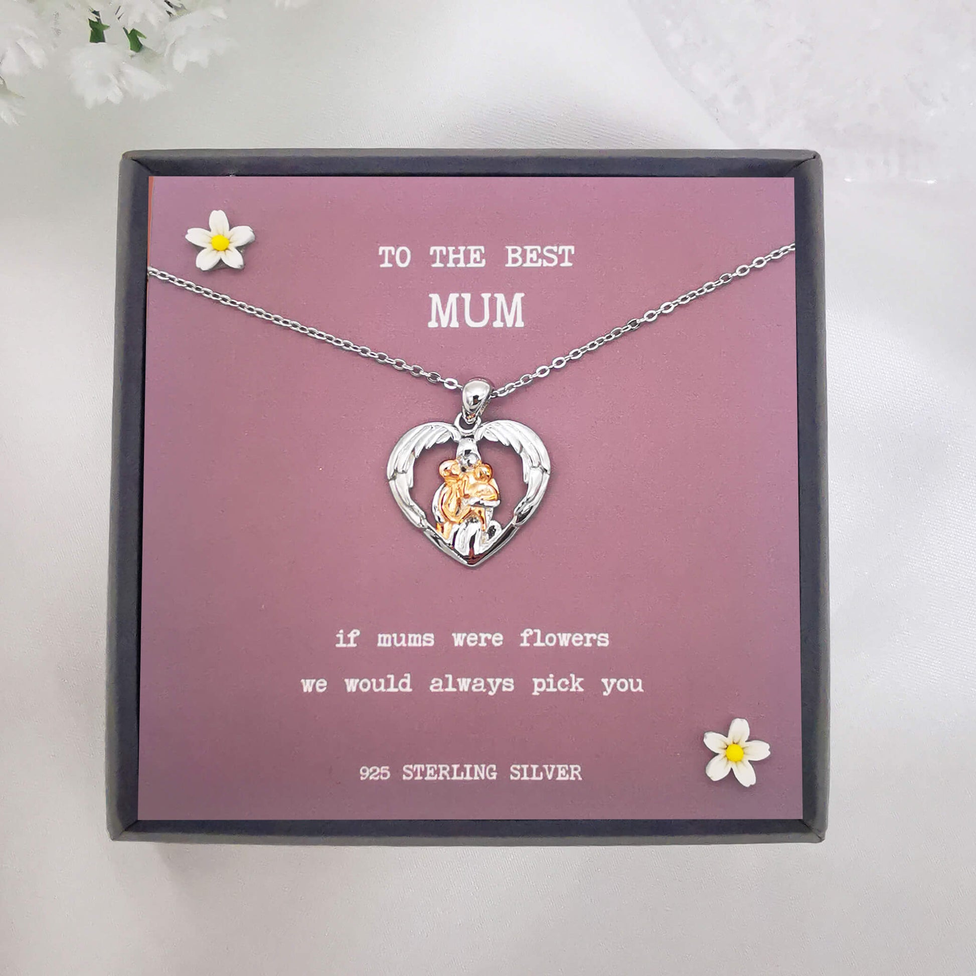 Sterling silver and rose gold necklace depicting mum hugging two children in wings. Features the quote "if mums were flowers we would always pick you". Comes boxed with quote insert. Grey coloured insert. 