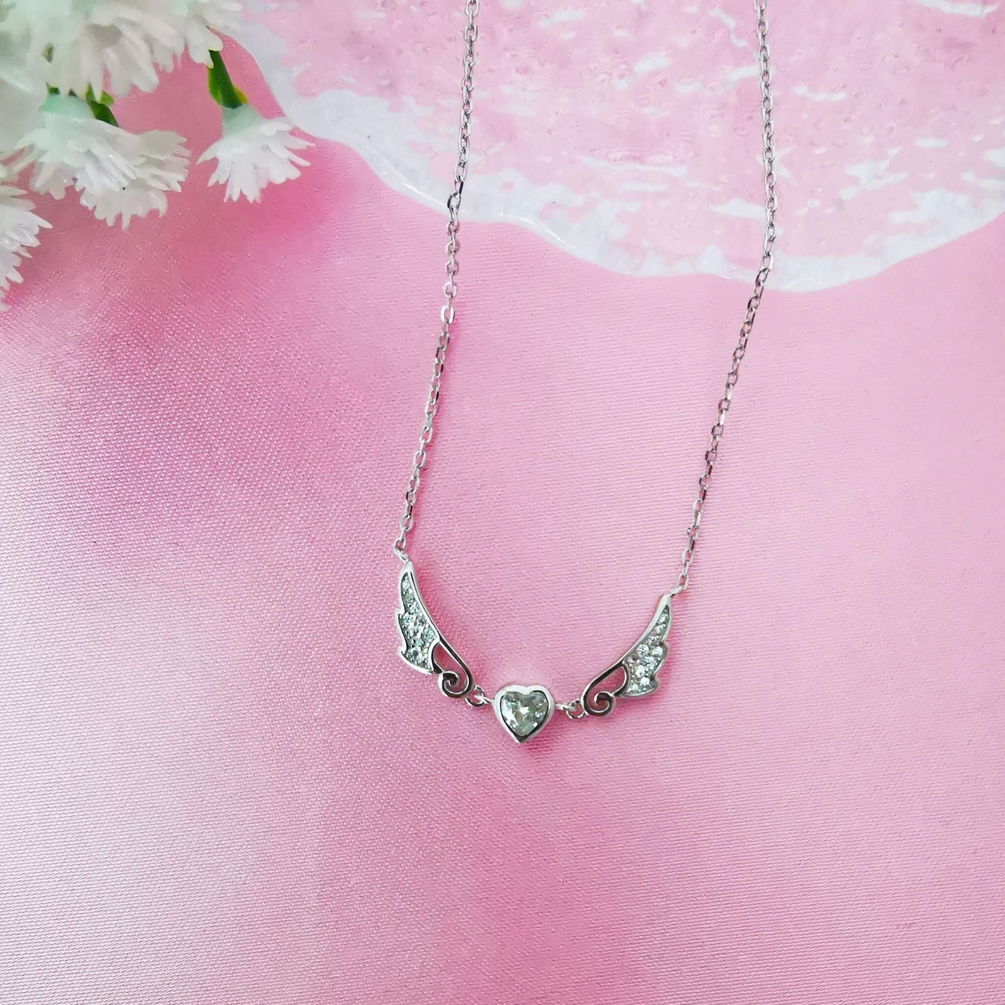 Sterling silver angel wing necklace pendant with central zirconia heart.  Beautifully presented and comes gift boxed with quote insert.