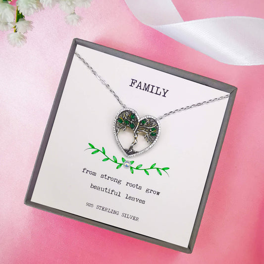 High quality detailed sterling silver tree of life pendant necklace with green zirconia. Boxed with handmade and hand embellished insert with the quote "from strong roots grow beautiful leaves".  Unique family gift keepsake for mum, sister, aunt, grandmother.