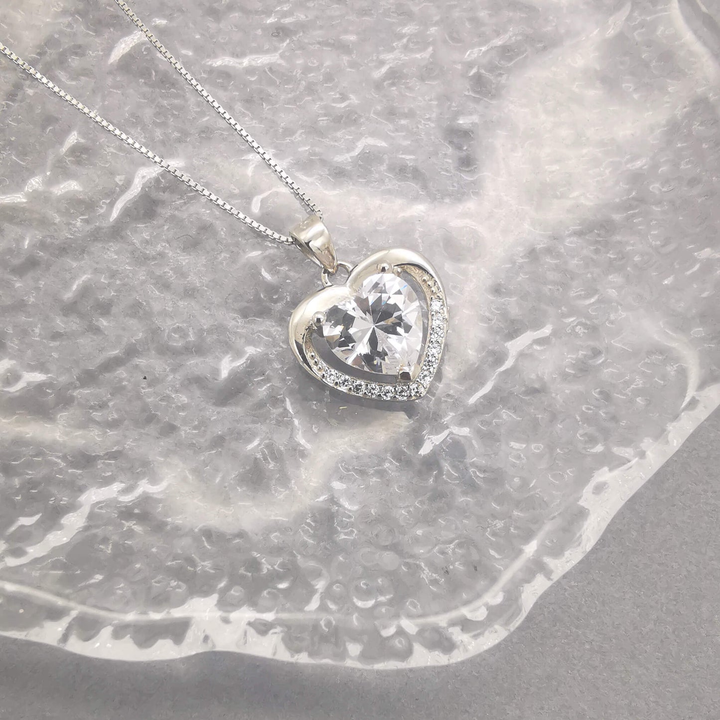 Sterling silver heart pendant necklace with cubic zirconia. 